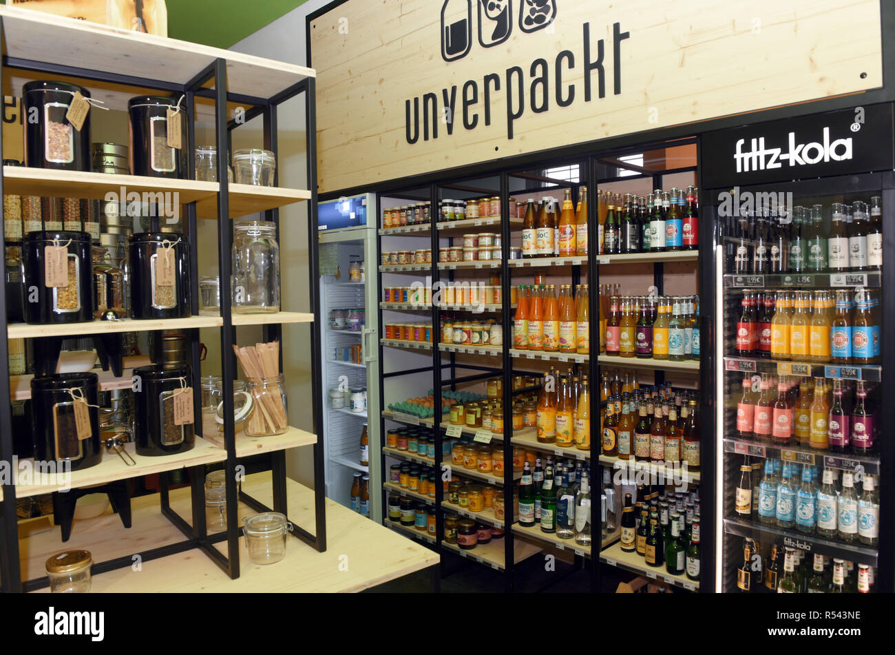 28 November 2018, North Rhine-Westphalia, Düsseldorf: Goods are stored in shelves in the store 'Unverpackt' opened a few days ago. The concept of the 'unpackaged shop' is that disposable packaging is not used in order to reduce the consumption of plastic. Customers bring their glasses or other containers with them for filling. Photo: Horst Ossinger/dpa Stock Photo
