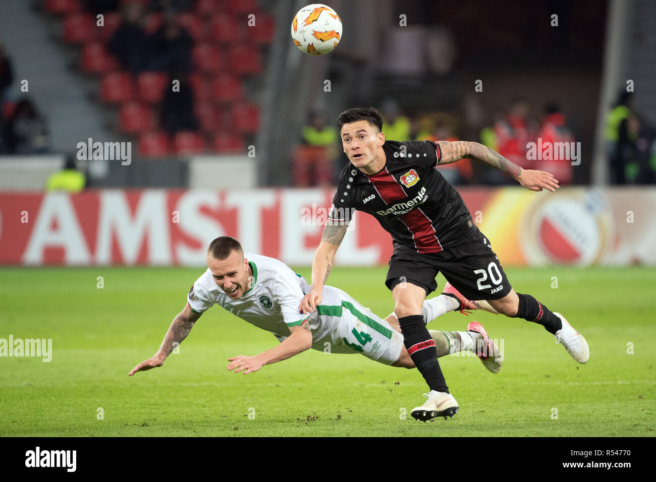 29 November 2018, North Rhine-Westphalia, Leverkusen: Soccer: Europa League, Bayer Leverkusen - Ludogorez Rasgrad, Group Phase, Group A, 5th matchday on 29.11.2018 in the BayArena. Leverkusen's Charles Mariano Aranguiz (r) and Jacek Goralski of Ludogorez fight for the ball. Photo: Federico Gambarini/dpa Stock Photo