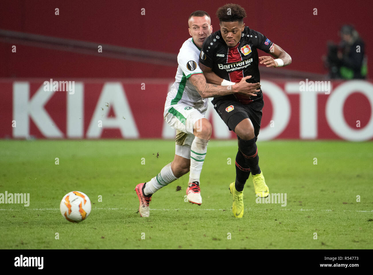 29 November 2018, North Rhine-Westphalia, Leverkusen: Soccer: Europa League, Bayer Leverkusen - Ludogorez Rasgrad, Group Phase, Group A, 5th matchday on 29.11.2018 in the BayArena. Leverkusen's Leon Bailey (r) and Jacek Goralski of Ludogorez fight for the ball. Photo: Federico Gambarini/dpa Stock Photo