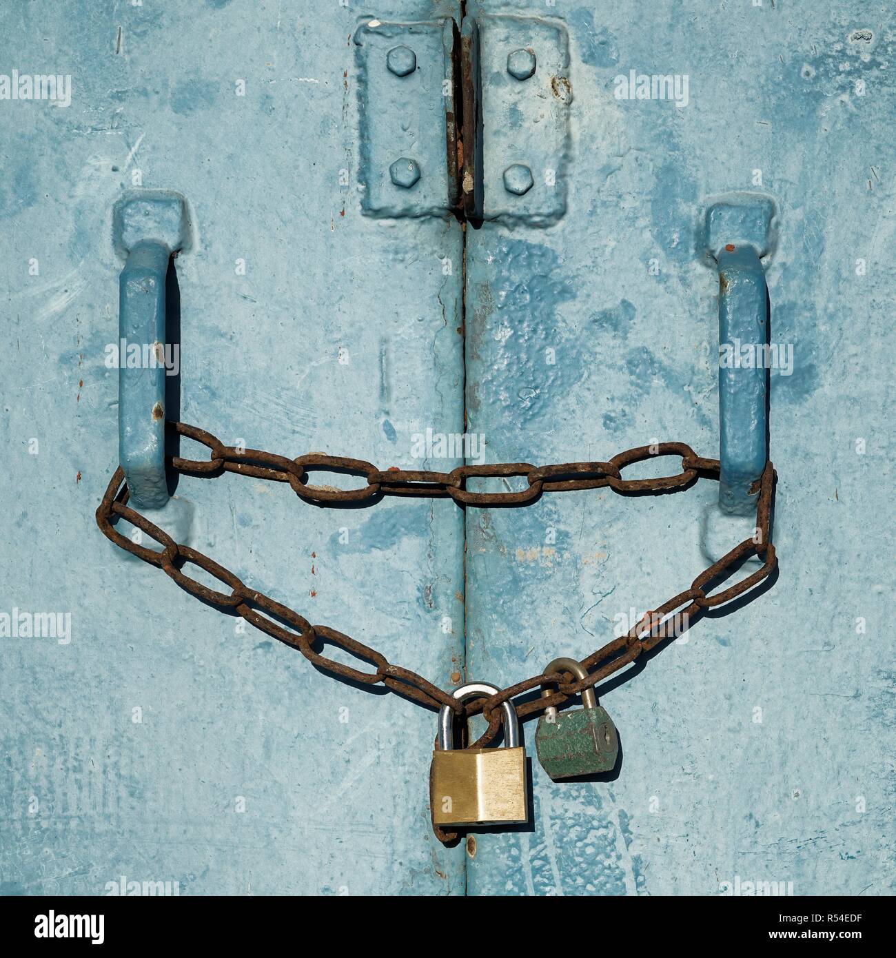 padlocks on a steel door Stock Photo