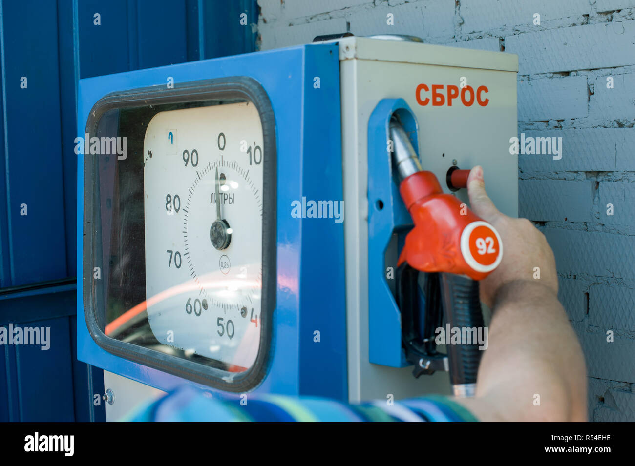 man at a gas station fills the fuel in the vehicle tank Stock Photo - Alamy