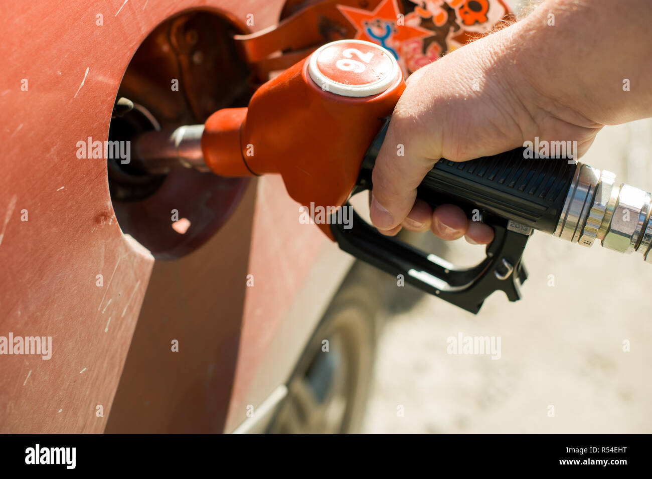 man at a gas station fills the fuel in the vehicle tank Stock Photo - Alamy