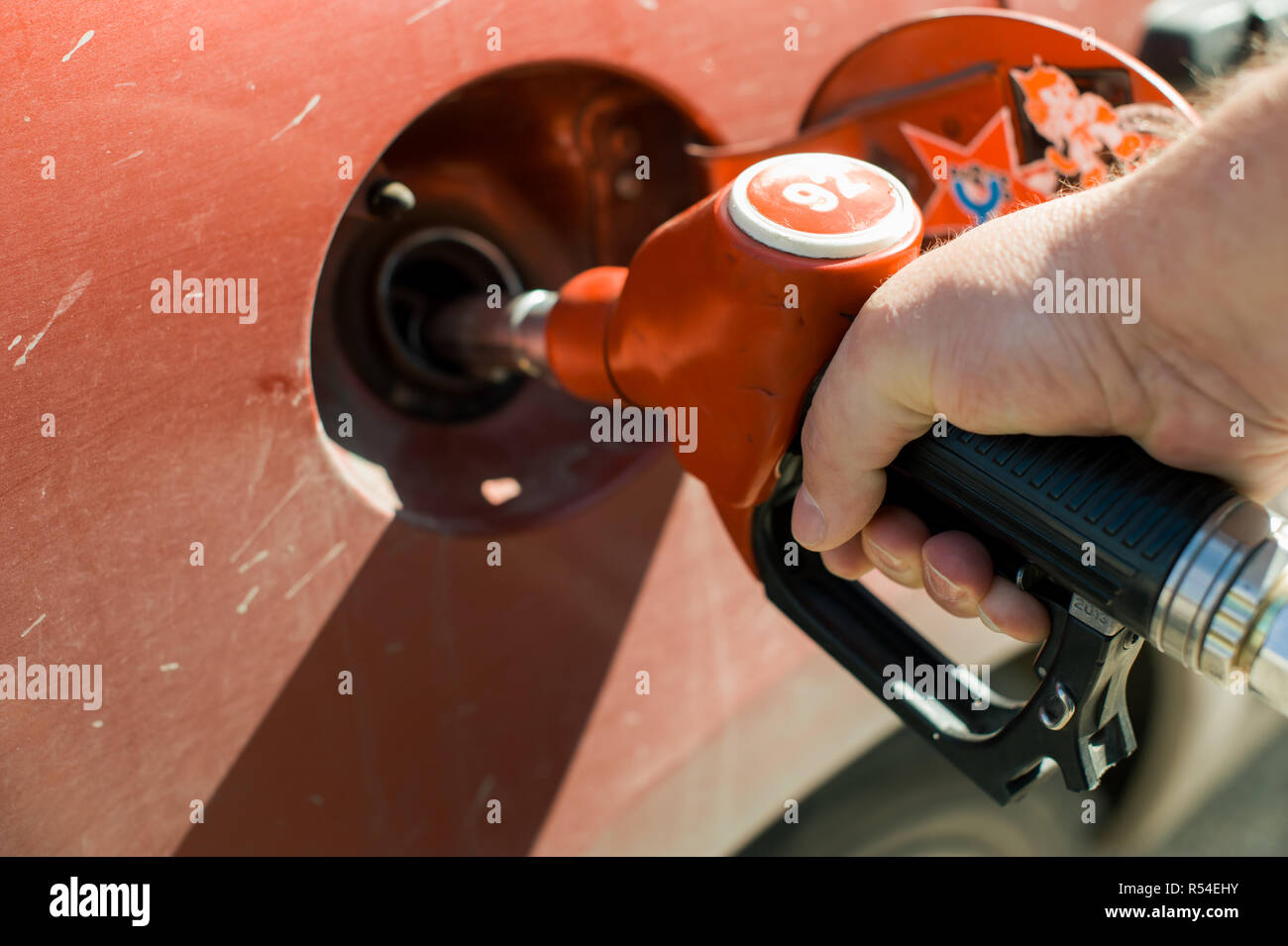 man at a gas station fills the fuel in the vehicle tank Stock Photo - Alamy