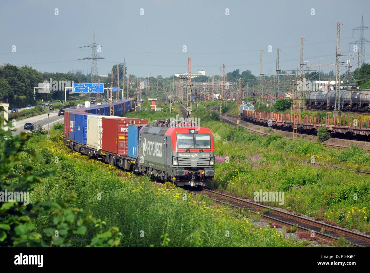 German Container Train Freight train with container and highway on 09.07.2016 in Gelsenkirchen ...