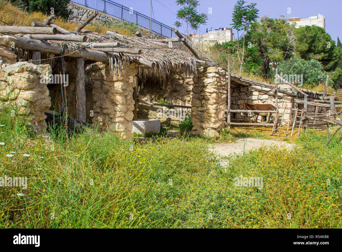 A timber built sun shade and stables in the open air museum of Nazareth Village Israel. This site gives an authentic look at the life and times of Jes Stock Photo