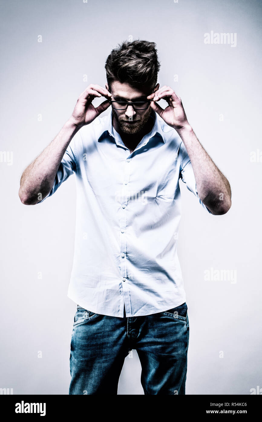 Man in glasses blue shirt hi-res stock photography and images - Alamy