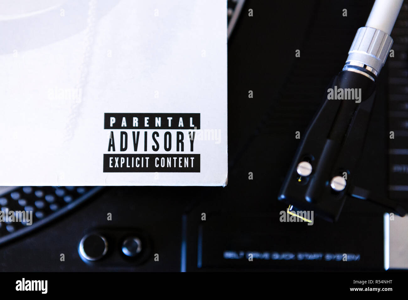 Close up of Parental Advisory lable on vinyl record sleeve on turntable Stock Photo