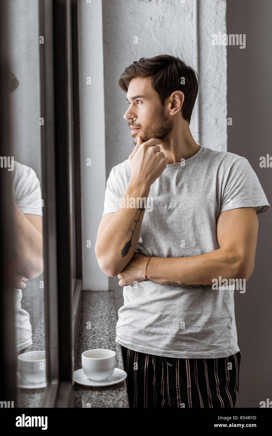 Handsome pensive young man hi-res stock photography and images - Alamy