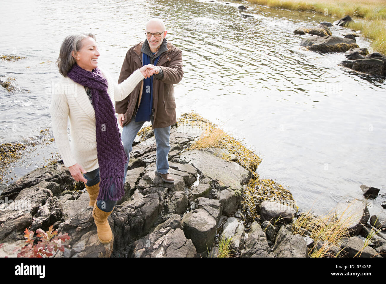 Elderly man woman walk rocks hi-res stock photography and images - Alamy