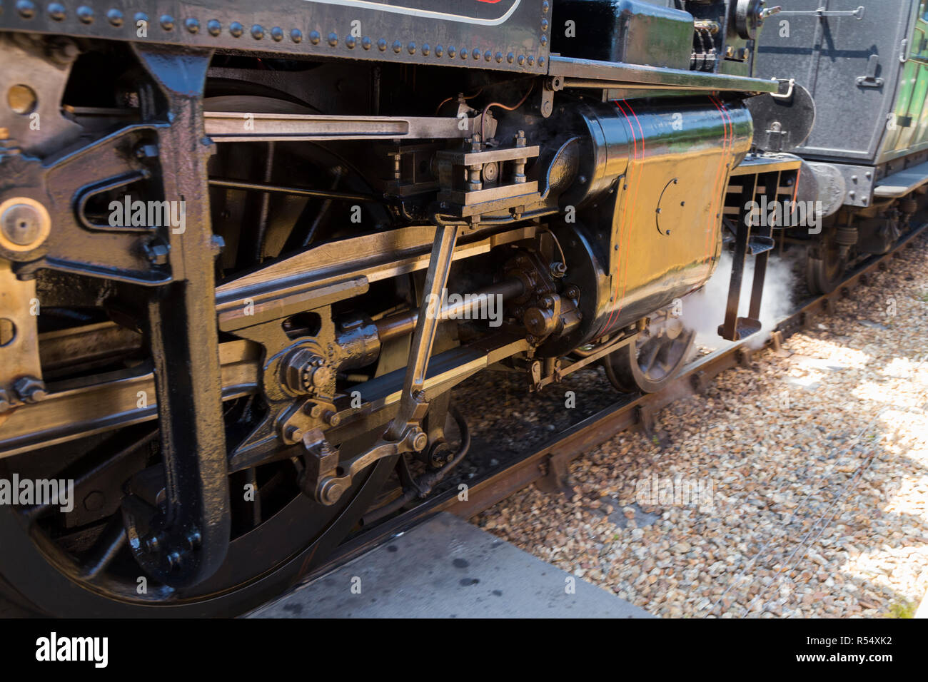 Close up of steam train wheels with Side rods / Coupling rods connecting the driving wheels of engine number 41298 together. Isle of Wight steam Railway. England UK (98) Stock Photo