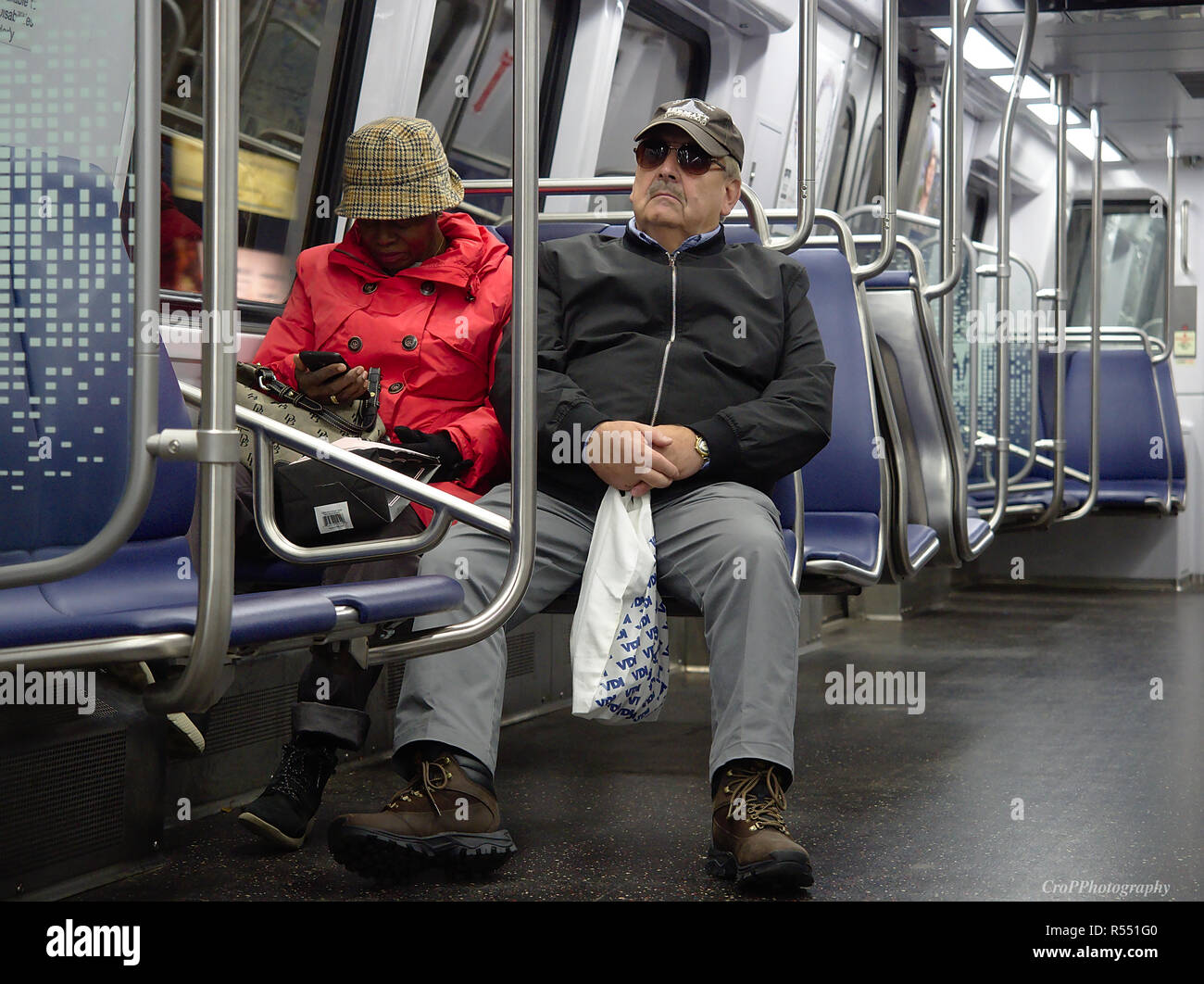 Senior couple riding metro train in Washington DC Stock Photo