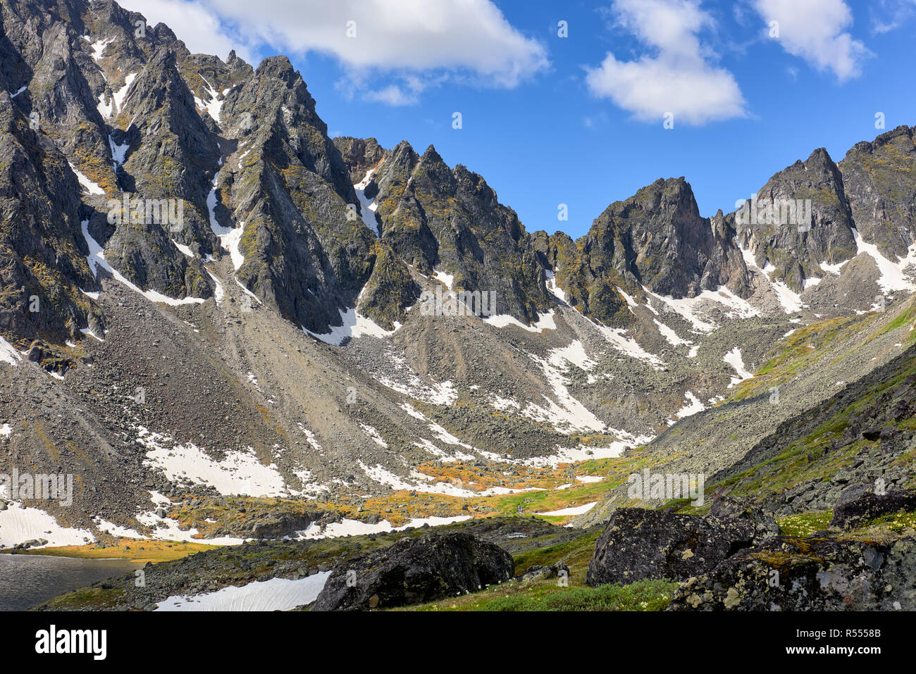 Spurs of mountain range in Eastern Siberia. June. Sayan mountains. Central Asia Stock Photo