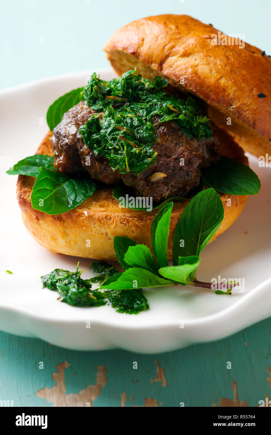 LAMB BURGERS WITH MINT SAUCE.style rustic .selective focus Stock Photo Alamy