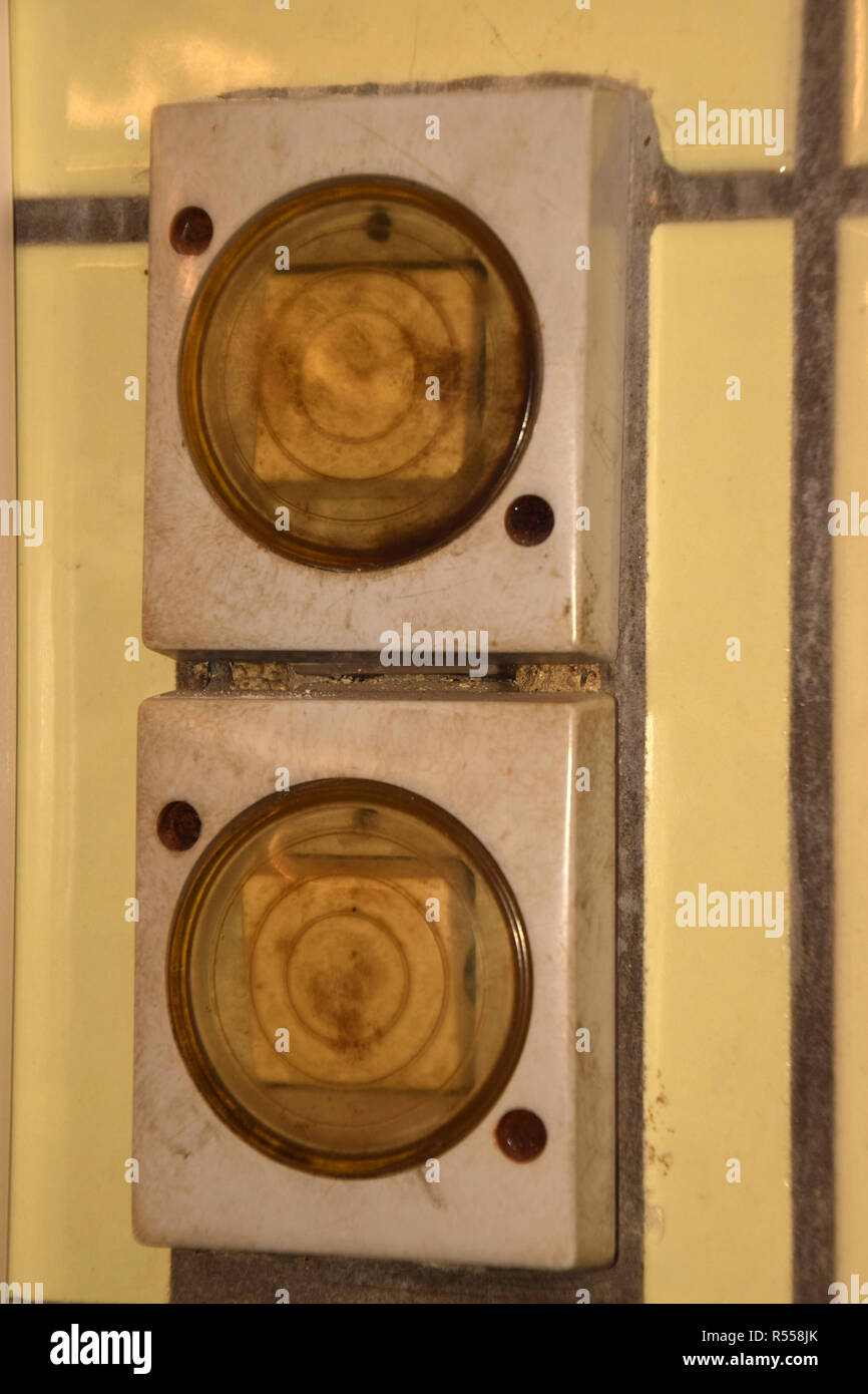yellowed outdated dirty light switches, old and dirty light switches with plastic cover