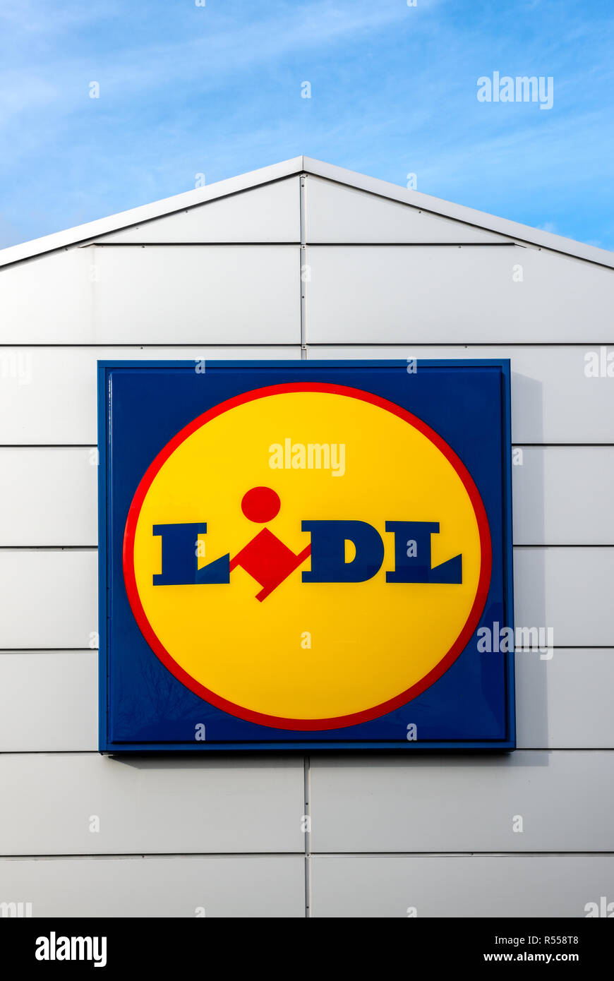 Lidl logo sign against blue sky Stock Photo
