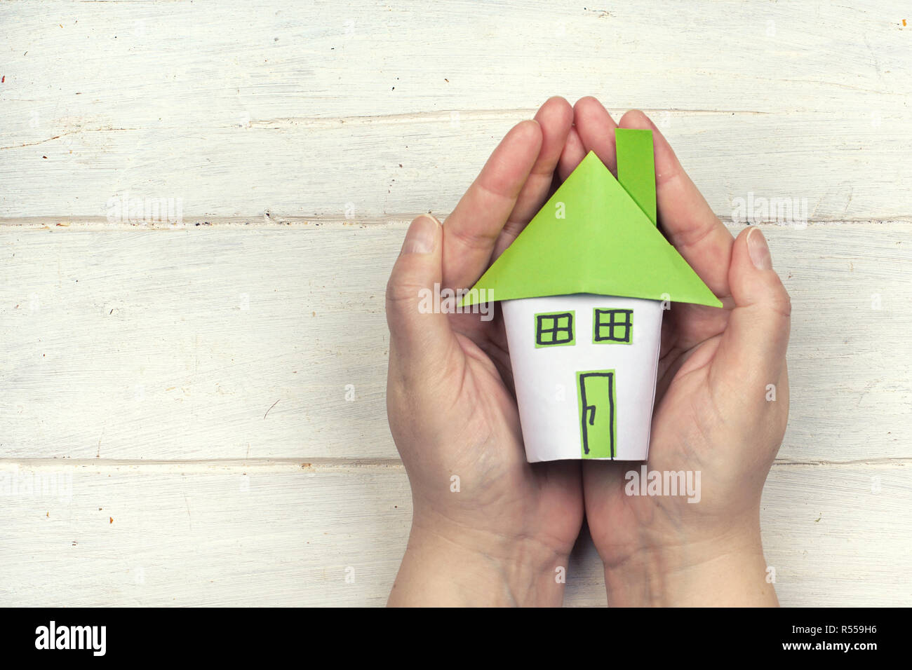 holding house in the hands Stock Photo