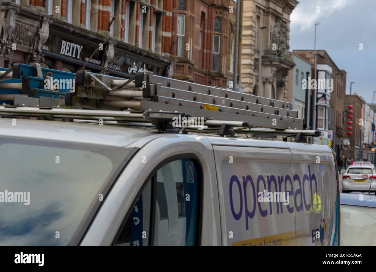 a bt openreach installers van parked in a city centre. British telecom ...