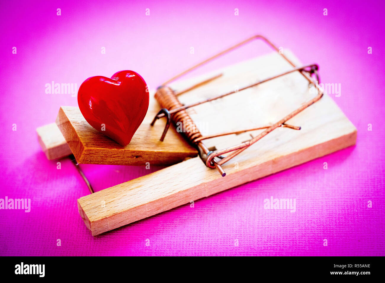 Heart in a mousetrap, Conceptual image on cardiovascular diseases. Stock Photo