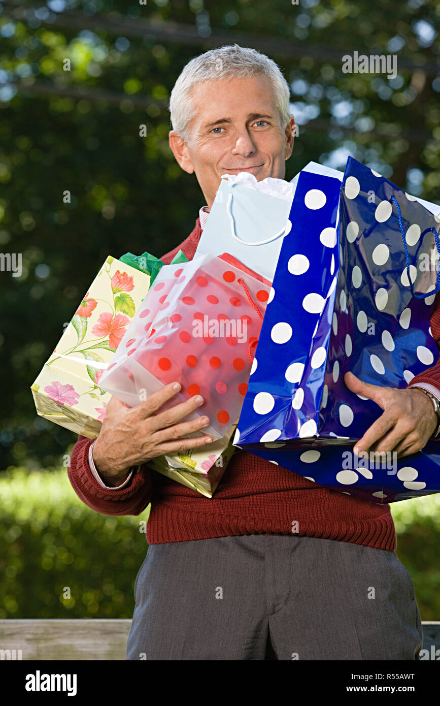 Man with shopping bags Stock Photo