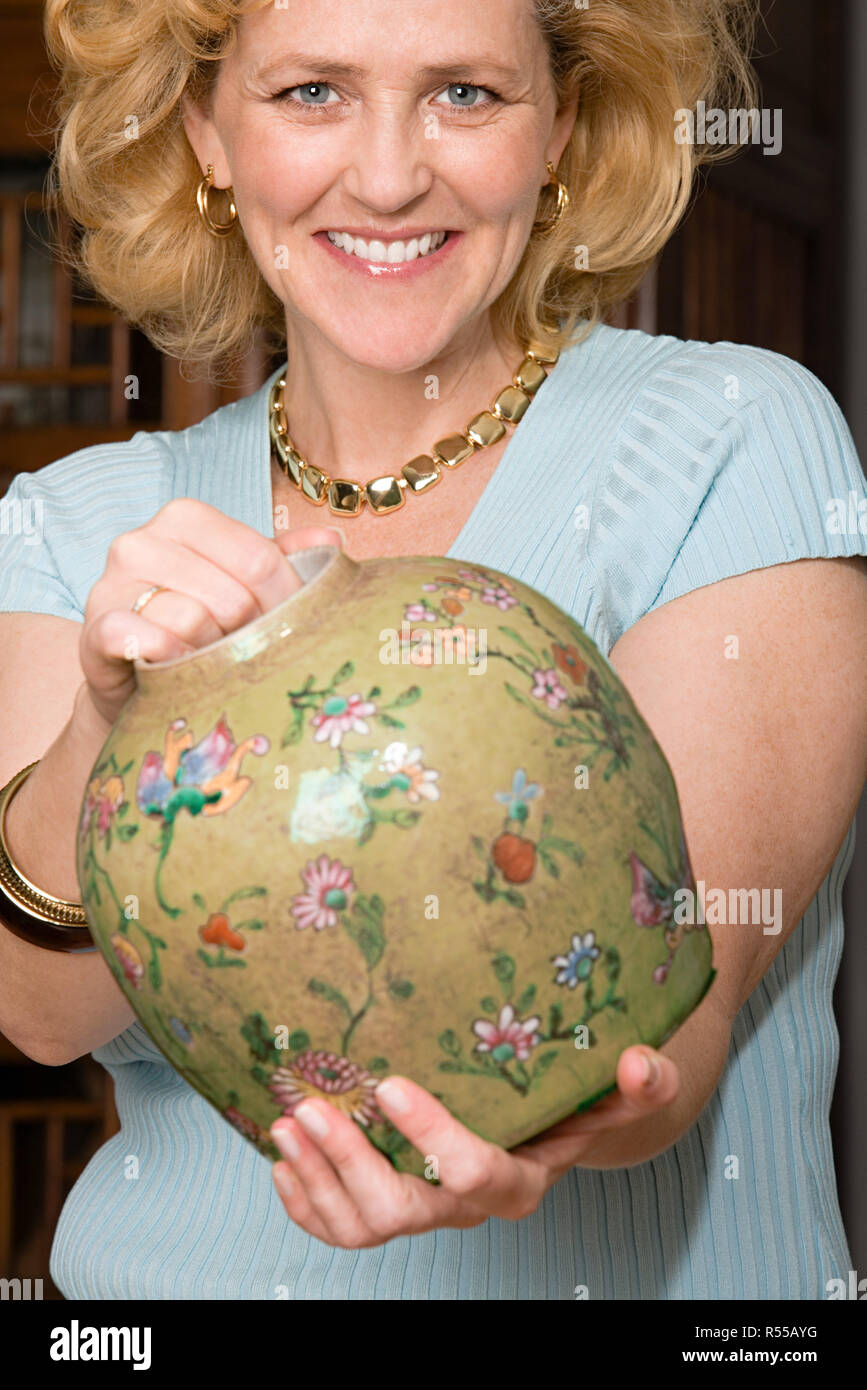 Woman with a vase Stock Photo