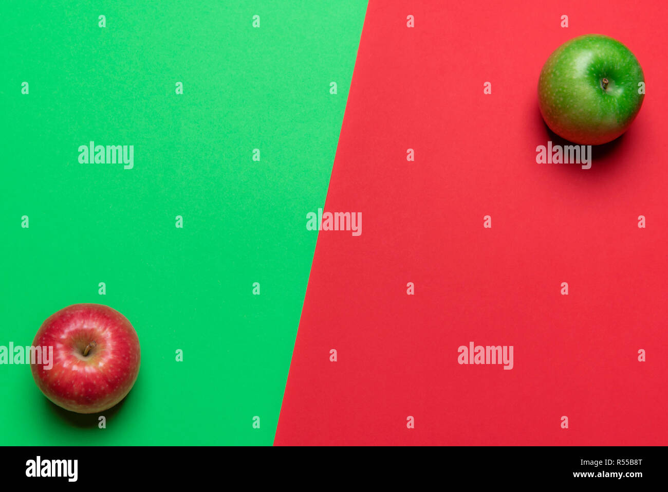 Above view of a duotone table with red and green apple fruits in