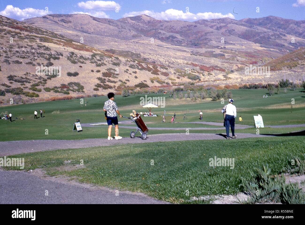 View of golfers walking the fairway at the Mountain Dell canyon course,  just outside Salt Lake City, Utah, 1967 Stock Photo - Alamy