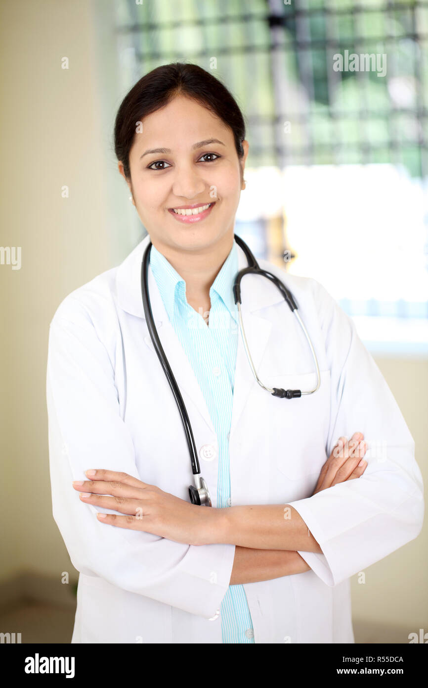 Smiling indian female doctor arms hi-res stock photography and images ...
