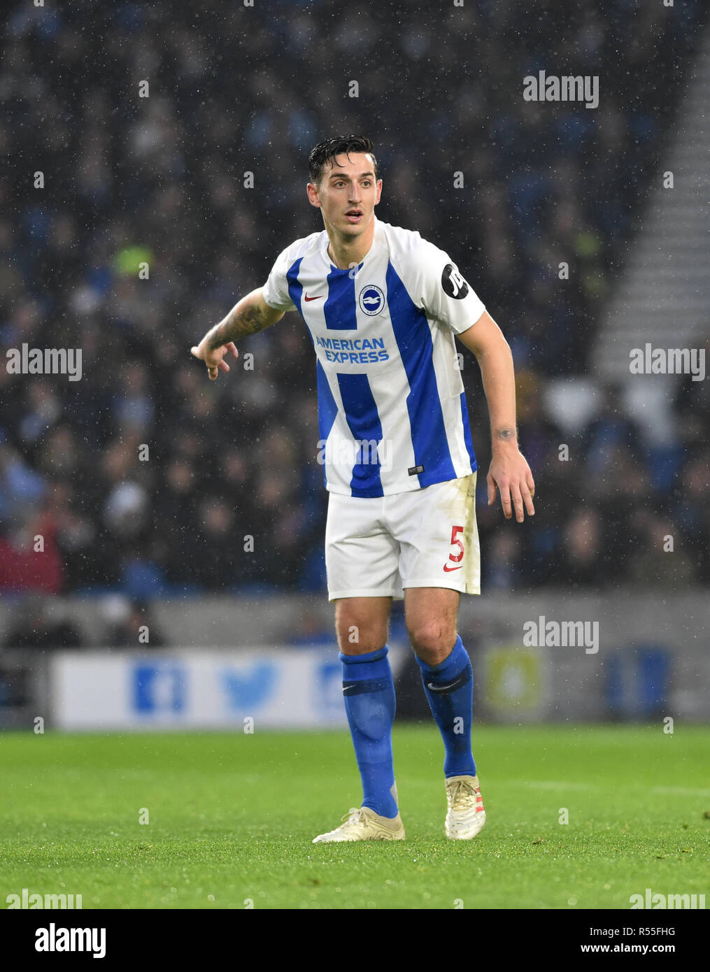 Lewis Dunk of Brighton during the Premier League match between Brighton and Hove Albion and Leicester City at American Express Community Stadium , Brighton , 24 November 2018 Editorial use only. No merchandising. For Football images FA and Premier League restrictions apply inc. no internet/mobile usage without FAPL license - for details contact Football Dataco Stock Photo