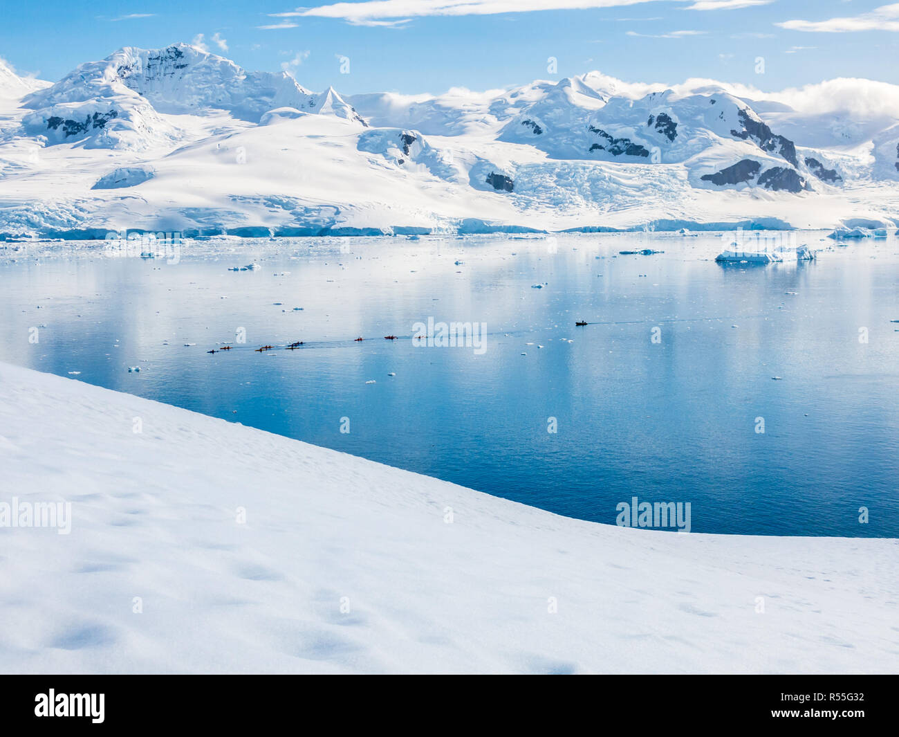 View from Neko Harbour down to Andvord Bay with people kayaking, Arctowski Peninsula, mainland Antarctica Stock Photo