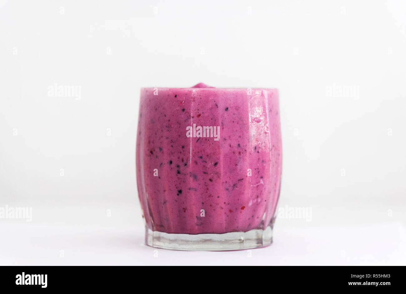 A mixed berry shake with natural yogurt and soy milk is shown in a