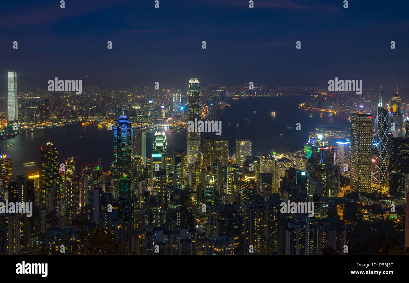 Hong Kong and Victoria Harbour at night viewed from Lugard Road, one of the best spot near Victoria Peak to enjoy the view of the city. Hong Kog, Janu Stock Photo