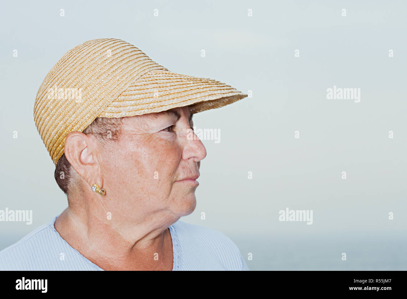 Older woman wearing straw hat hi-res stock photography and images - Alamy