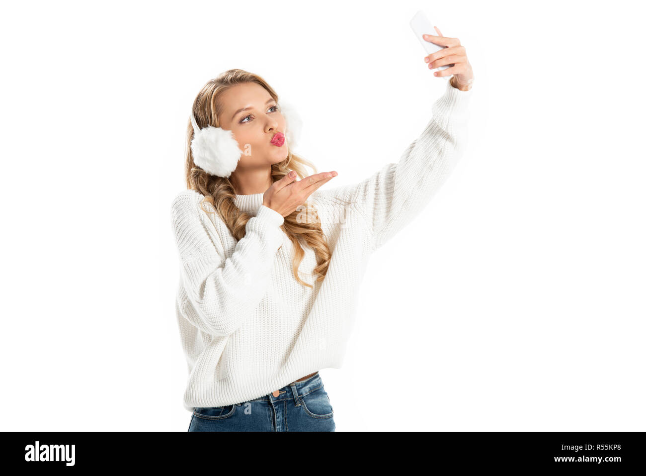 Happy Blonde Girl Blowing Kiss While Taking Selfie On Smartphone