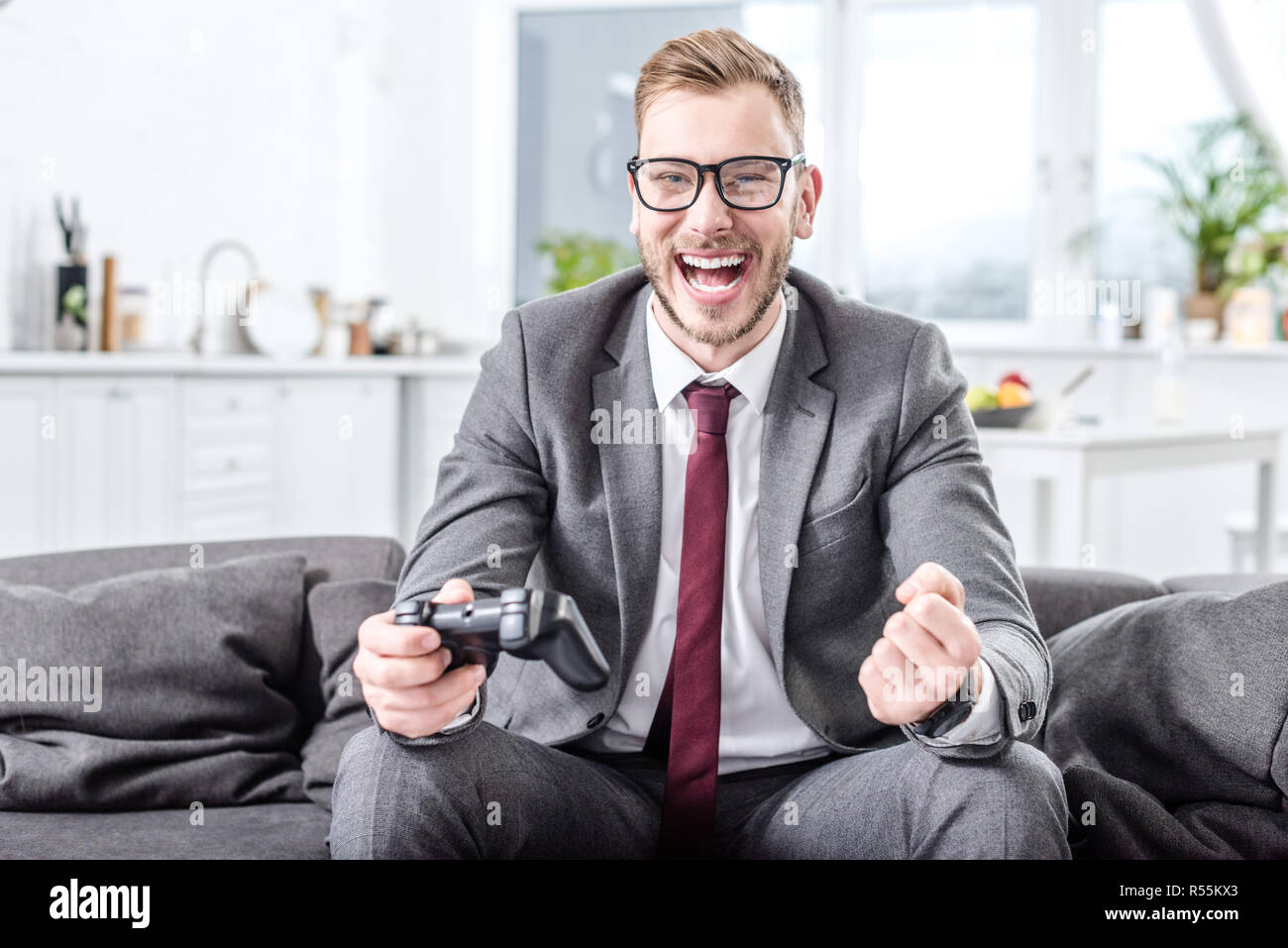 Holding console hi-res stock photography and images - Alamy