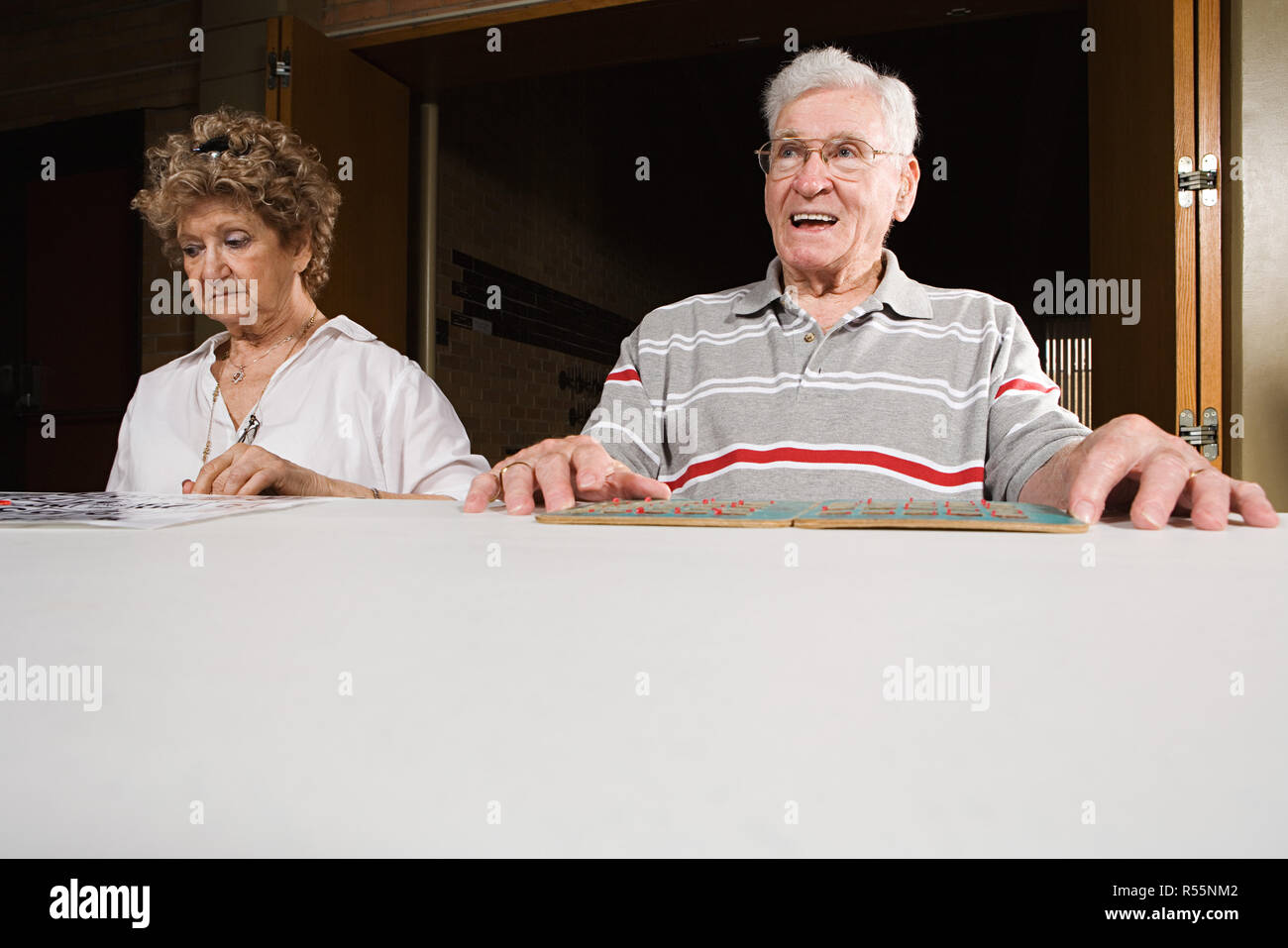 Two seniors playing bingo Stock Photo - Alamy