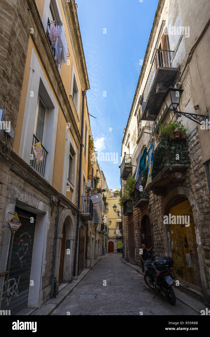 A narrow street in Bari historic centre, called in Italian "Bari Vecchia". Bari, Apulia, Italy, August 2017 Stock Photo