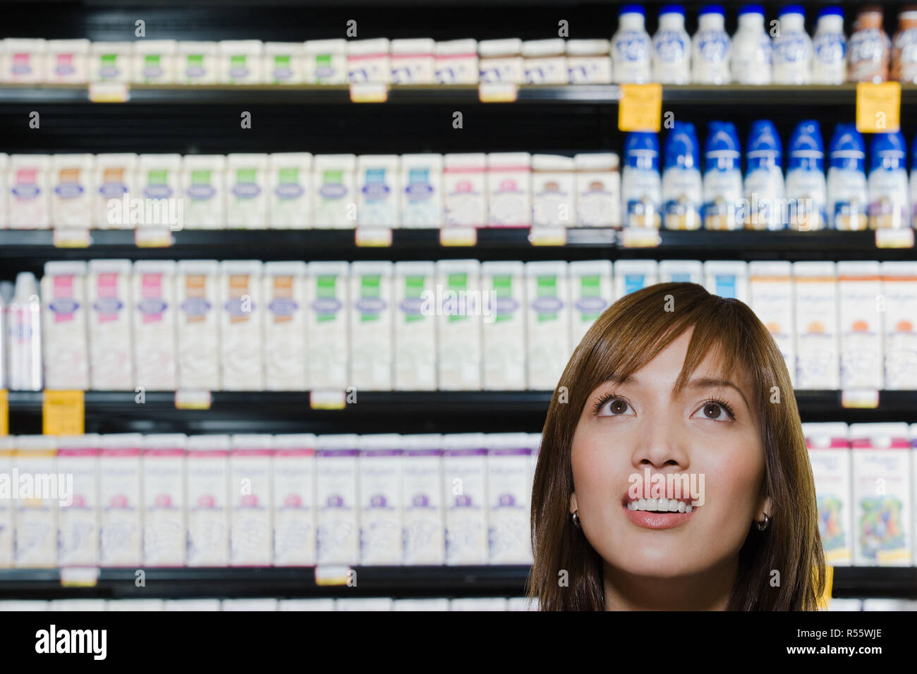 Young woman shopping in a supermarket Stock Photo