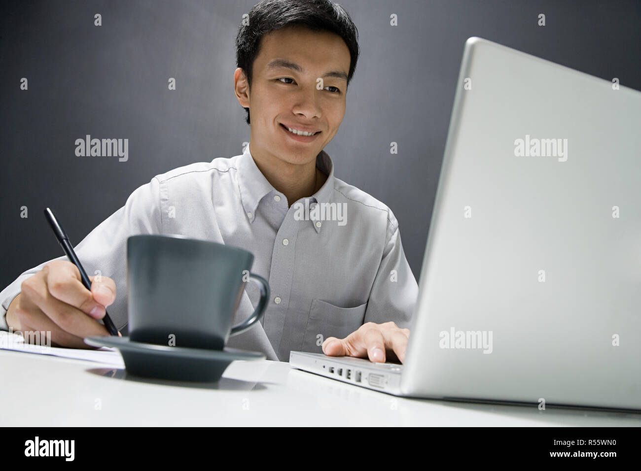 Man working on laptop Stock Photo