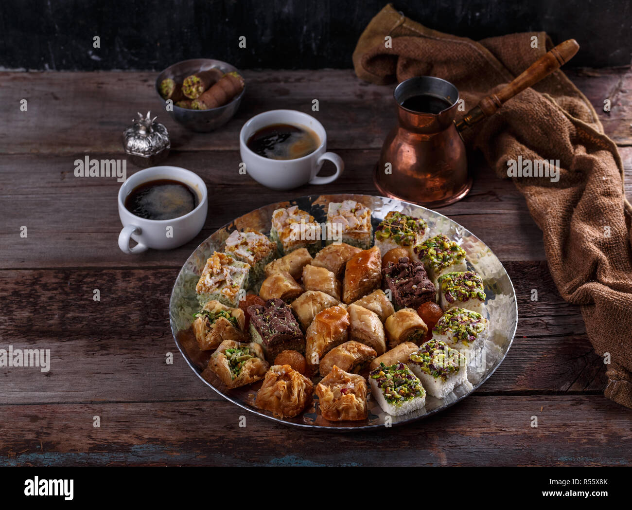 Arabic Baklava with coffee on silver tray, copy space Stock Photo - Alamy