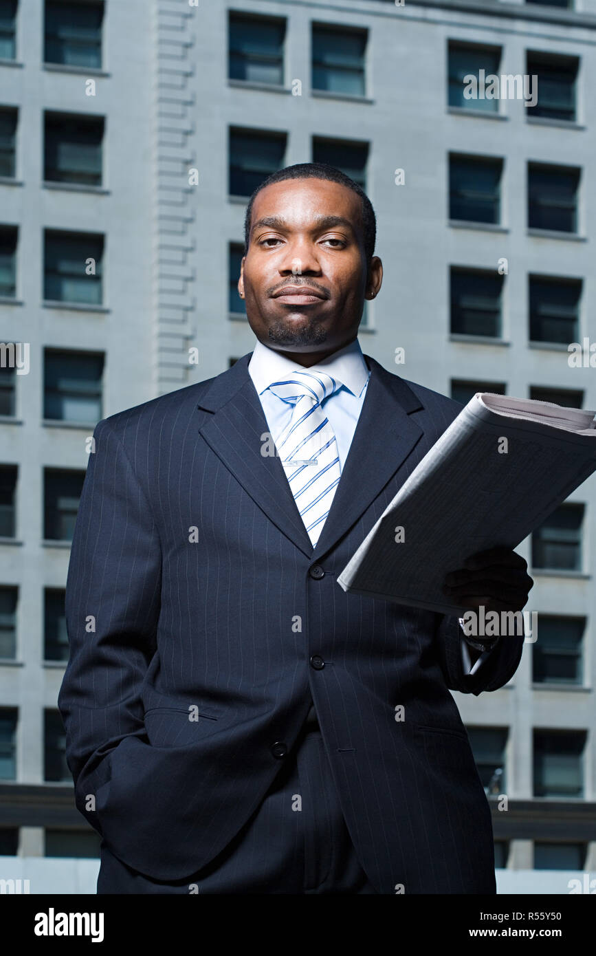 Businessman with newspaper Stock Photo