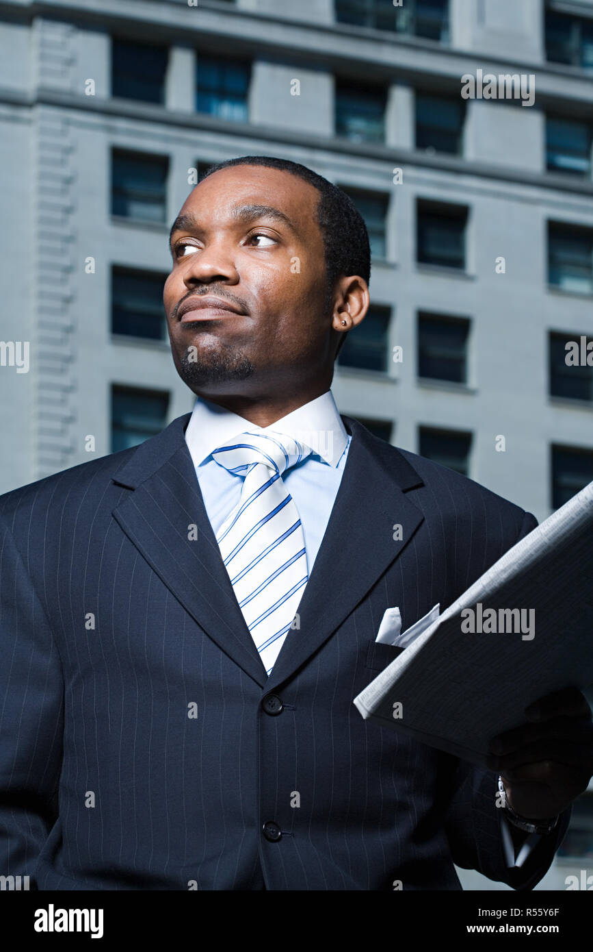 Businessman with newspaper Stock Photo