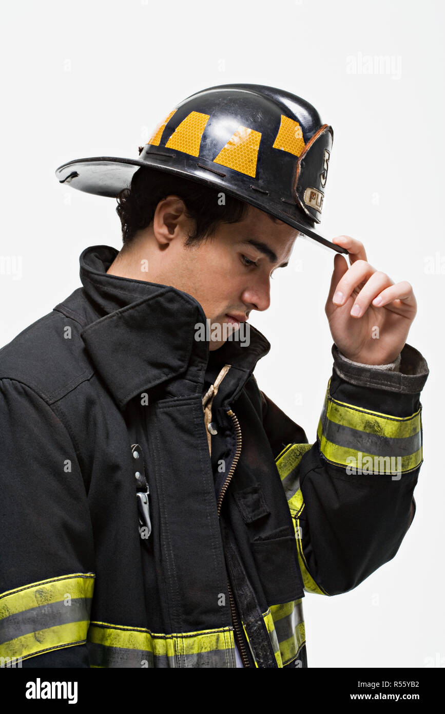 Firefighter tipping his hat Stock Photo