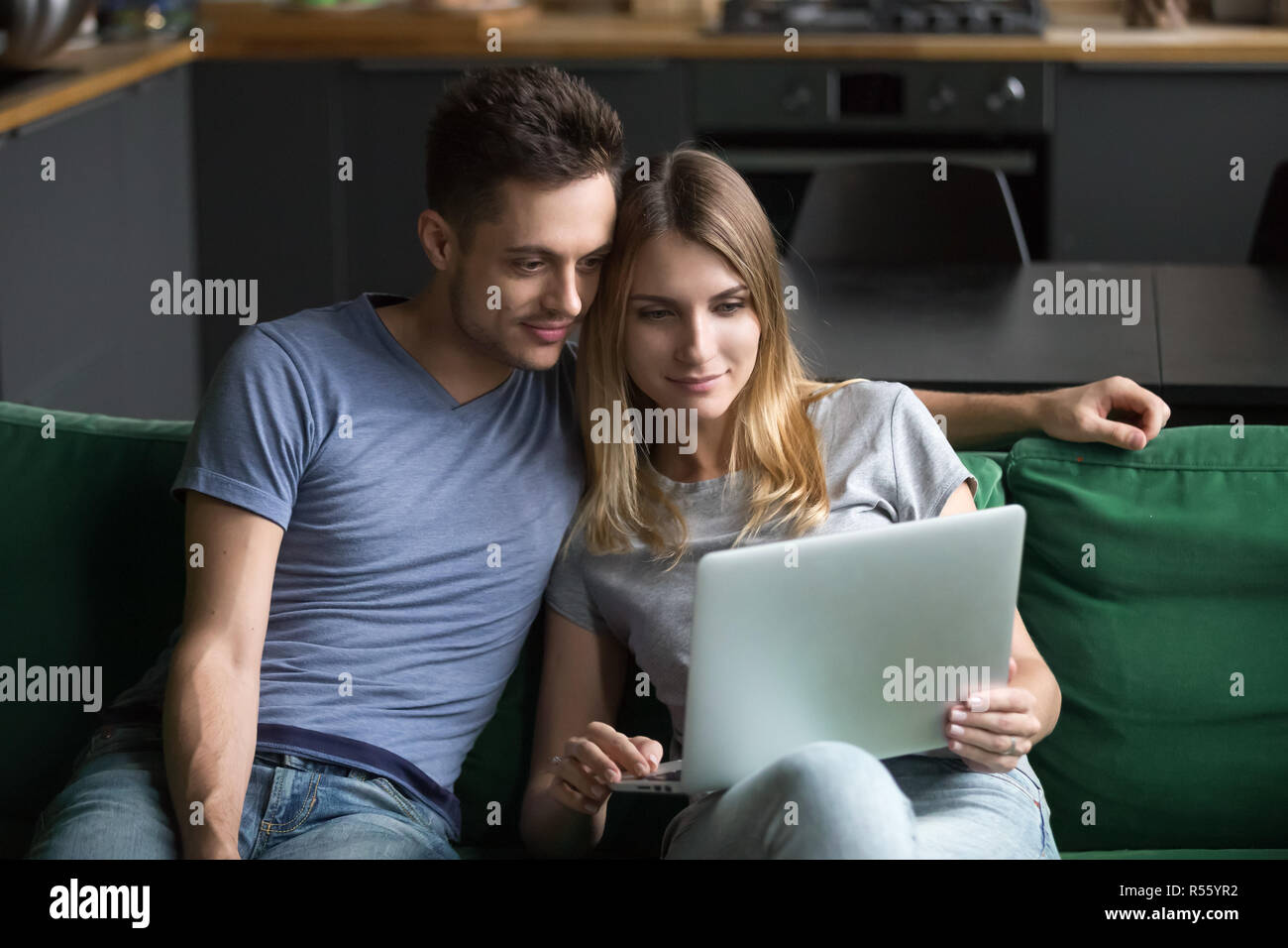 Family watching laptop screen together hi-res stock photography and ...