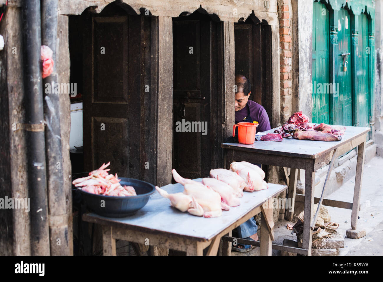 KATHMANDU, NEPAL APRIL 2015 butcher selling meat in his streen shop