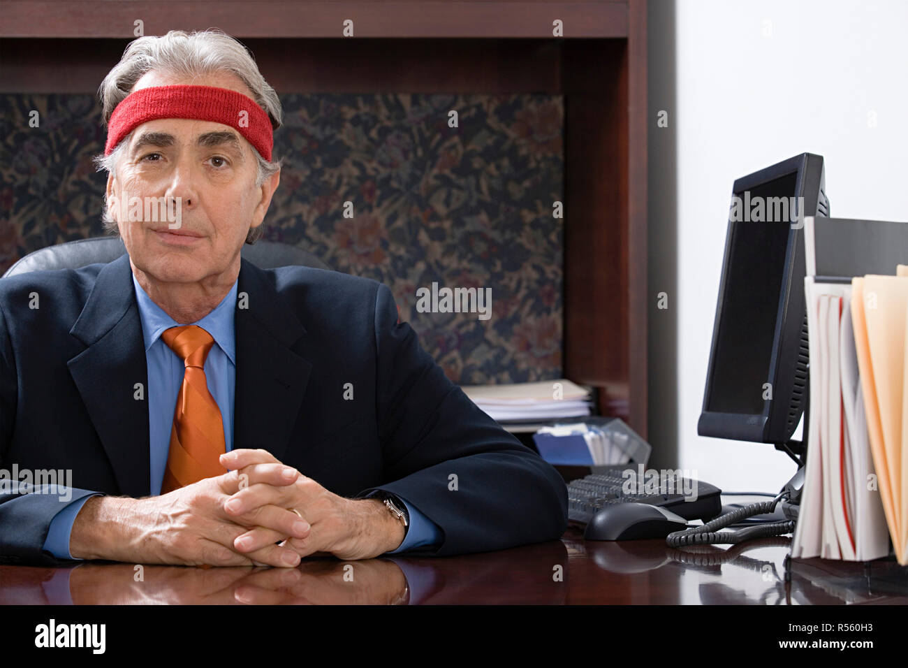 Businessman wearing a sweatband Stock Photo