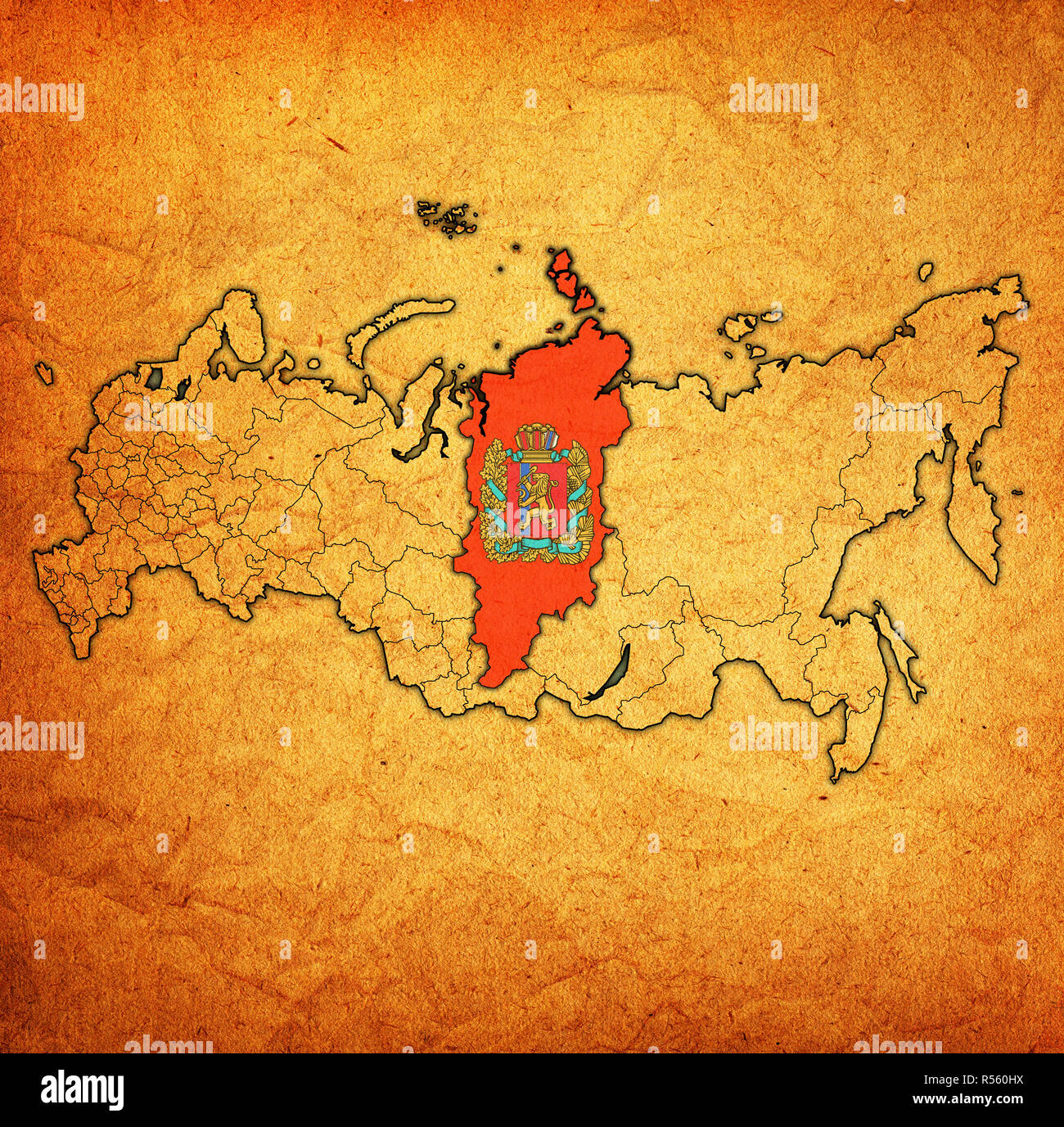 emblem of Krasnoyarsk krai on map with administrative divisions and borders of russia Stock Photo