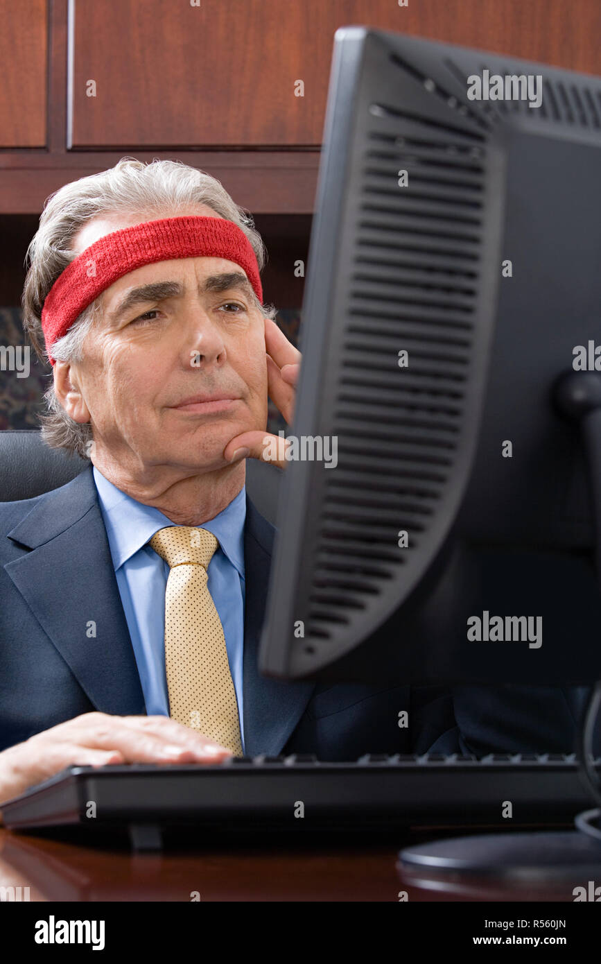 Businessman wearing a sweatband Stock Photo