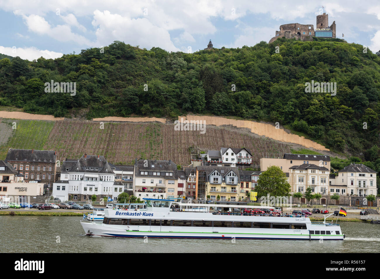 Bernkastel, Germany.  A Tourist River Cruise Boat on the Moselle.  Landshut Castle Ruins on Hilltop. Stock Photo