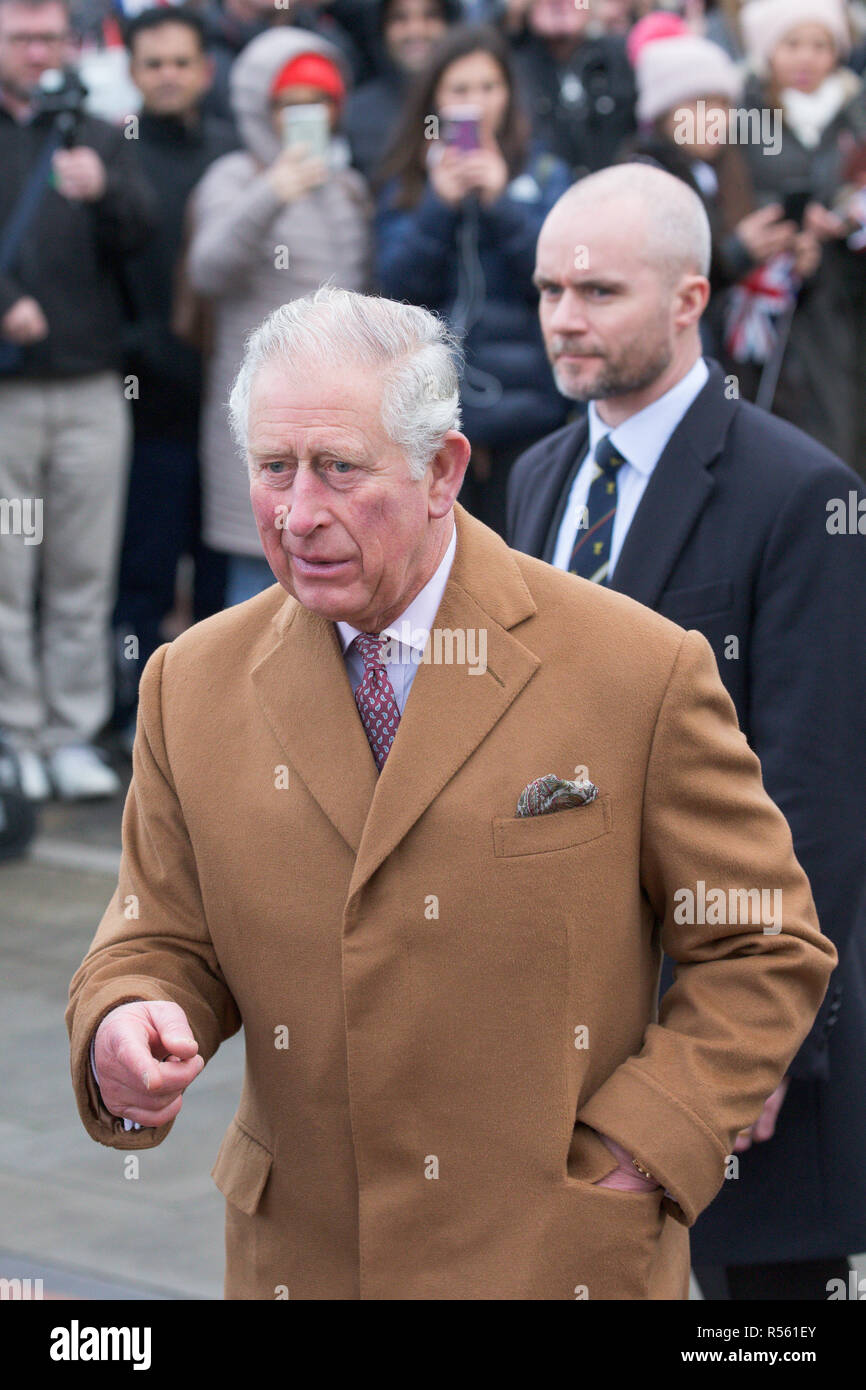 Prince Charles and Camilla,Duchess of Cornwall,visiting  Ely Farmers' Market in Cambridgeshire.   Prince Charles was given a big kiss by a woman in the crowd as he arrived at Ely Farmers' Market in Cambridgeshire today (Wed).  The Prince of Wales received the warm welcome as he met stallholders together with the Duchess of Cornwall.  The couple were introduced to a variety of traders, including producers of Aberdeen Angus beef, flower farmers, local growers of salad vegetables, chillies and soft fruit, as well as bakers and vegan food entrepreneurs. Stock Photo