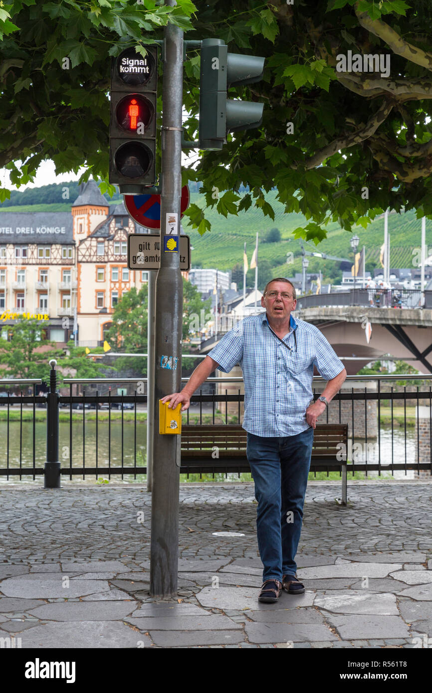 Bernkastel, Germany.  Man Watching for Crosswalk Light to Turn Green. Stock Photo